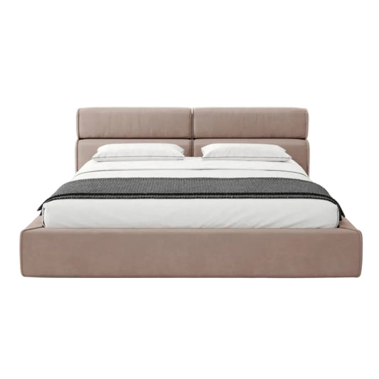 A modern platform bed with a tall, padded double headboard upholstered in a dusty pink fabric, styled with white bedding and a dark gray textured throw blanket, set against a plain white background.