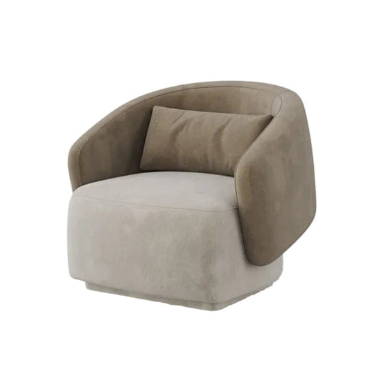 A modern barrel-style accent chair upholstered in a textured taupe fabric, featuring a matching throw pillow, set against a clean light gray background.