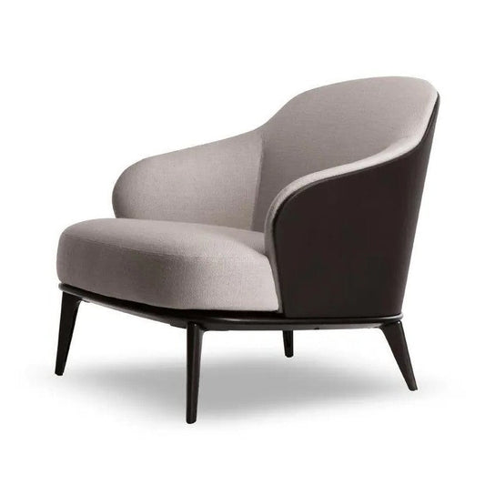 A modern barrel-style accent chair with a curved light gray fabric seat and back, a dark brown side panel, and tapered black legs, shown on a white background.