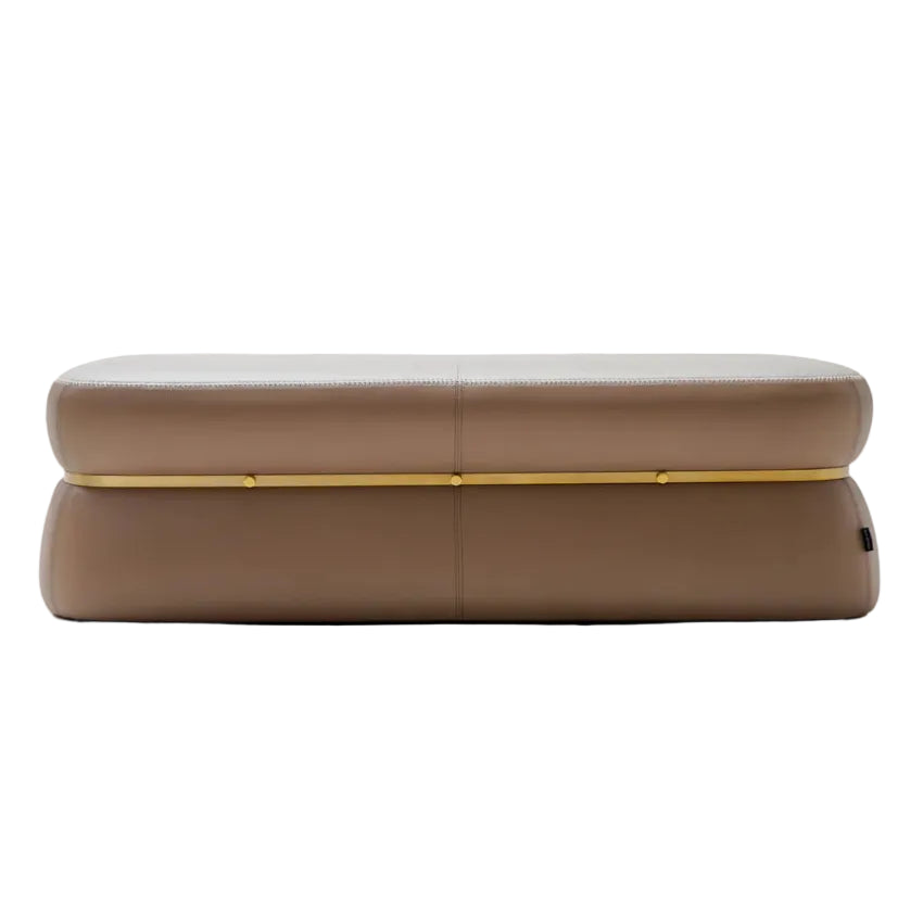 A modern rectangular bench or ottoman upholstered in taupe-brown leather with a thin gold metal accent line across the front, shown against a plain white background.