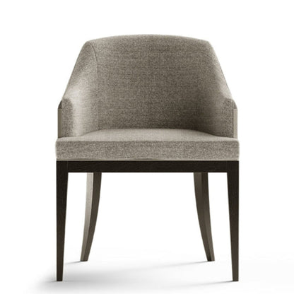 A modern upholstered dining chair with a curved backrest, light gray textured fabric, and dark tapered wooden legs, shown against a plain white background.
